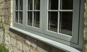 Close up of a chartwell green uPVC Residence Collection flush sash window