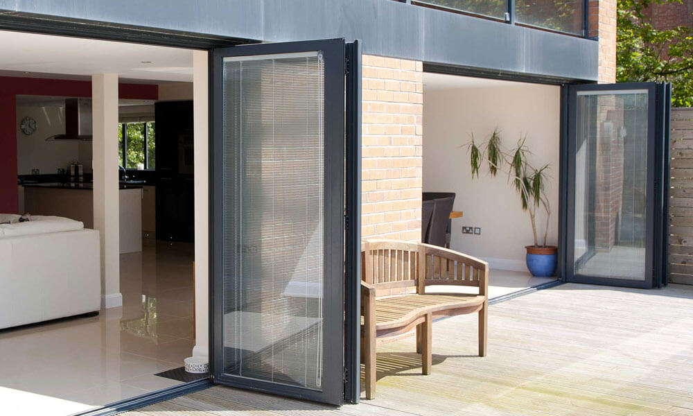 Dual aluminium bifold doors with integral blinds