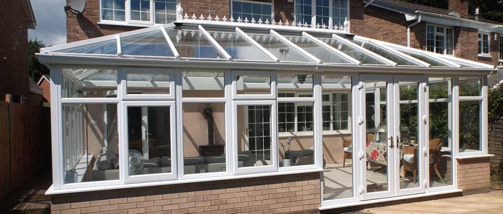 White upvc bespoke conservatory with upvc patio doors