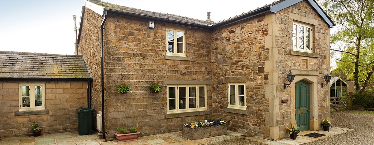 Farm house with cream timber windows