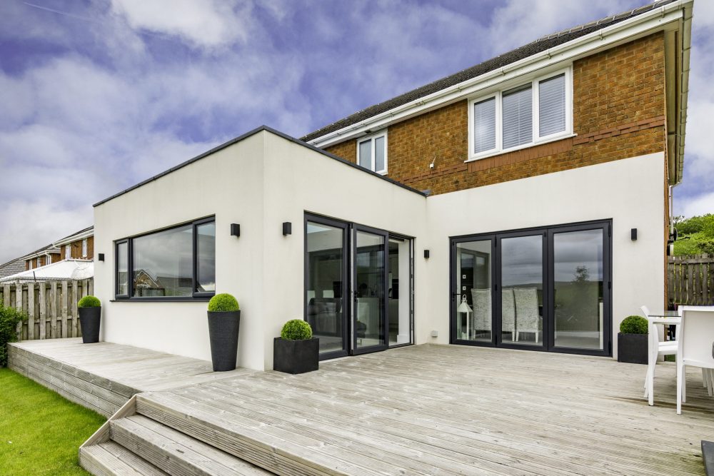 modern orangery with black sliding patio doors