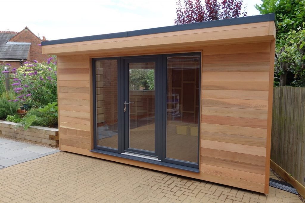 Oak garden room with anthracite grey door