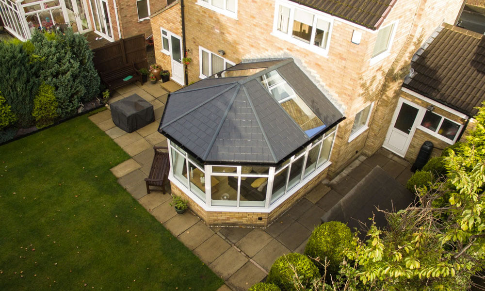 White uPVC conservatory with a tiled roof
