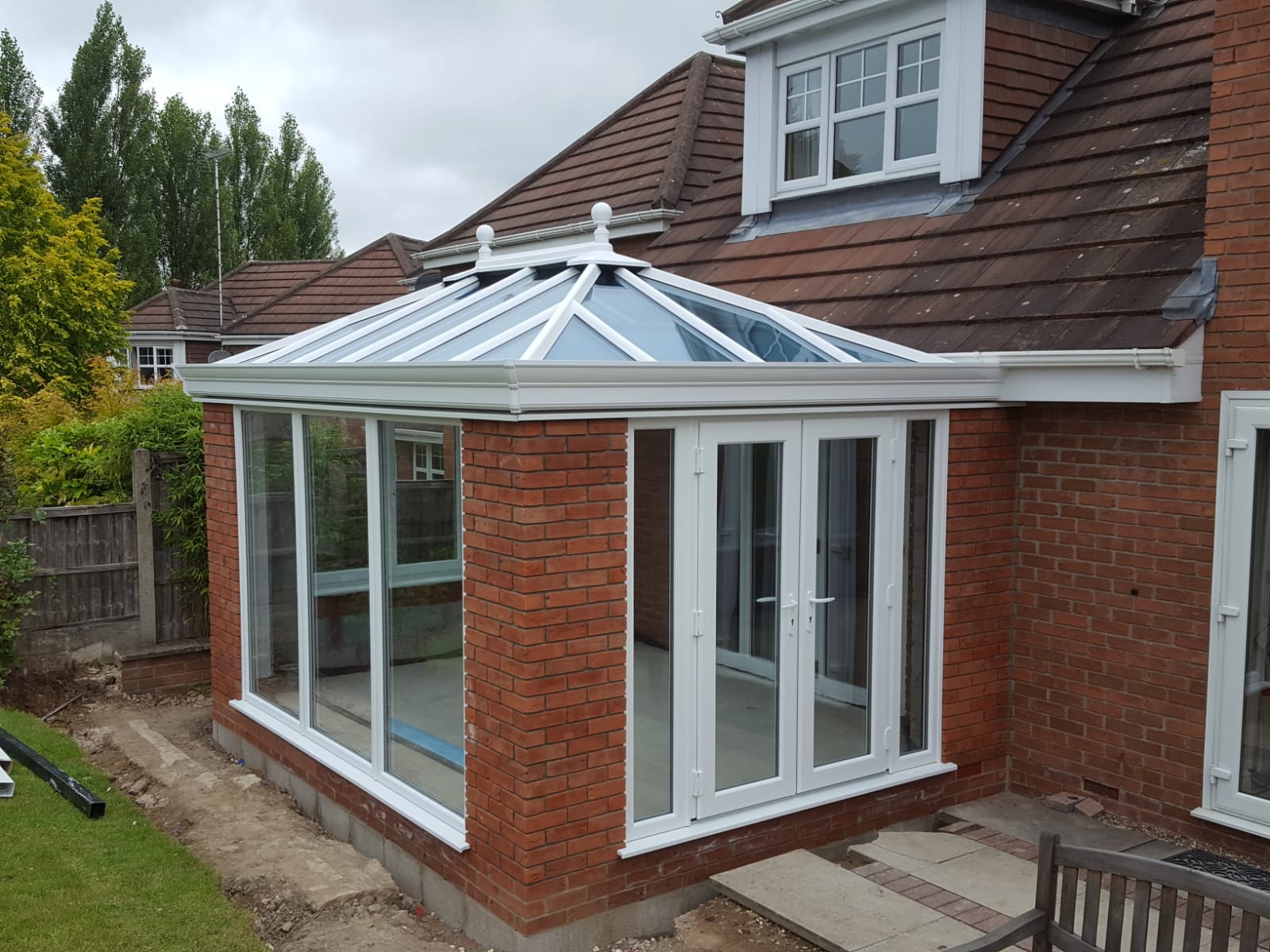 white and brick orangery