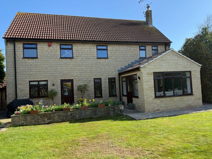 A traditional home transformed with warmer windows, a secure new door and a year-round conservatory